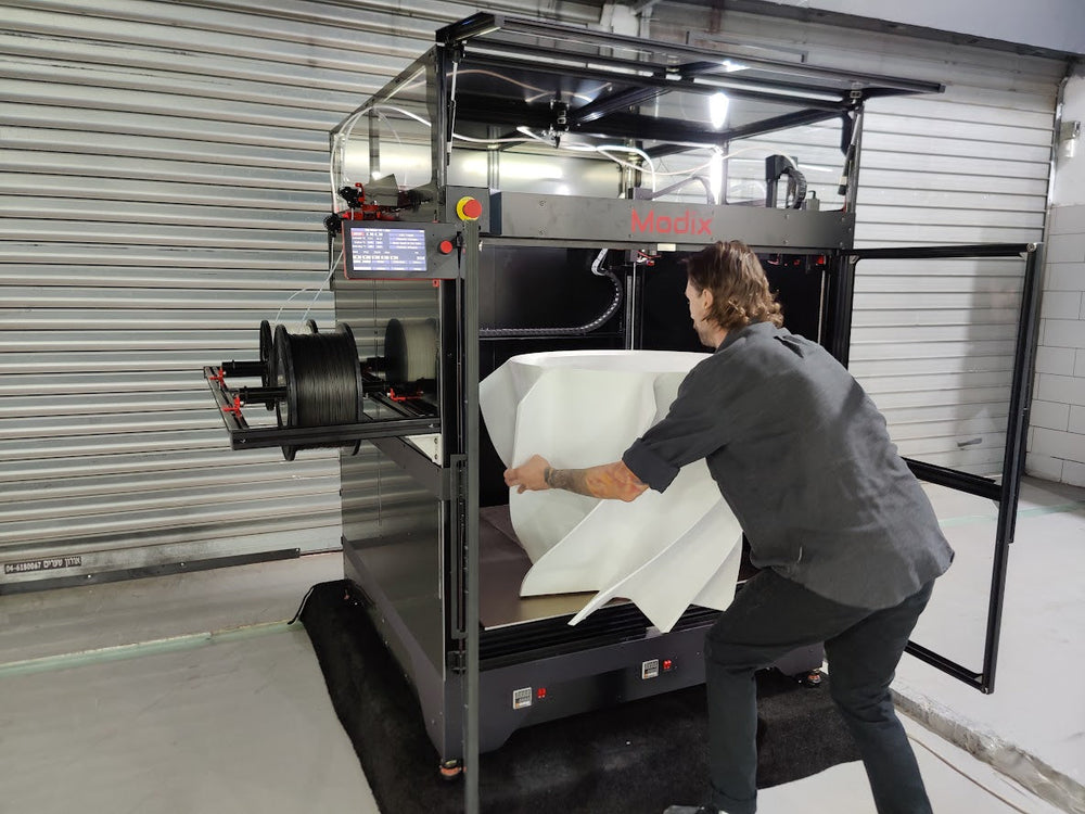 Removing a large printed part from the Modix BIG-Meter through the open front doors